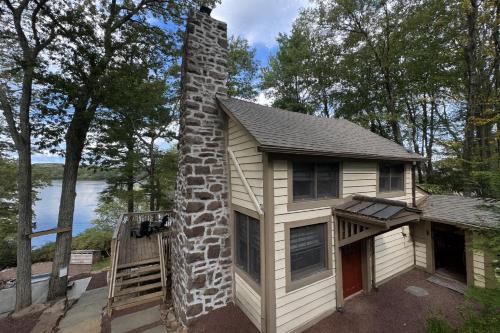 Lake Harmony House | Lakefront Cabin with Hot Tub, Views & Fireplace