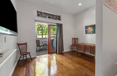 Honokaa House | Cozy Ohana suite with private patio, deck, & tropical garden setting