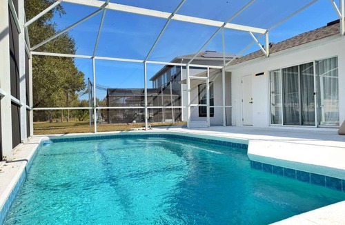 Crescent Lakes House | Designer house near Disney with private pool, water views, and custom pool table