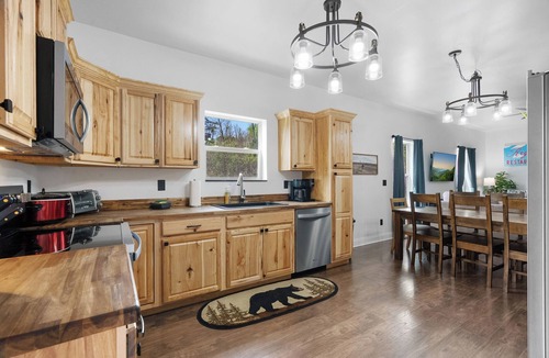 Chalet Village North Cabin | Flat 4bedrm Chalet Village with outdor spaces, 2 picnic tables,firepit,kids area
