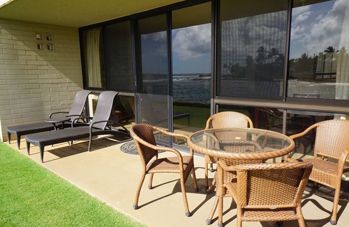 Poipu Condo | Fully Renovated Oceanfront with Air Cond. Ground Floor Unit with Spacious Lanai!