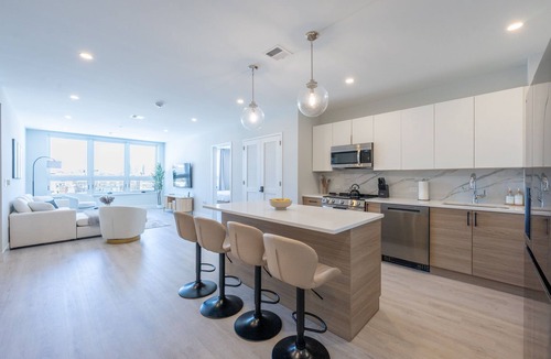 Historic Downtown Apartment | Luxe 2BR Retreat 5-Min PATH to NYC With Rooftop+Gym