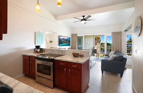 Wailua Condo | Ocean View 3 Bed Suite - Sleeps 6 with Pool & A/C - Steps to the Sand in Kapaa!