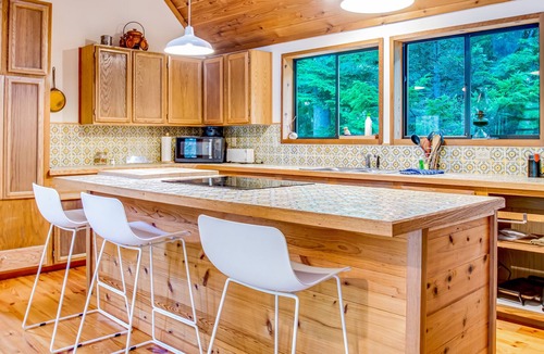 Marrowstone Cabin | Rustic cabin with wraparound deck and wood stove in a tranquil location