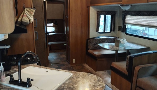 Beautiful travel trailer with private fenced in yard, deck, and fire pit. in Dade City