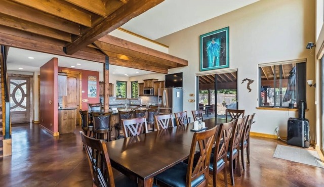 Custom riverfront home with private dock, game room, hot tub & heated floors in Laclede
