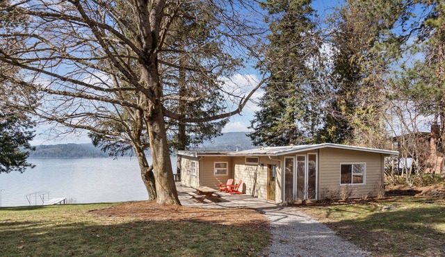 Rustic lakefront retreat with private beach, dock & large deck - dog-friendly in Harrison