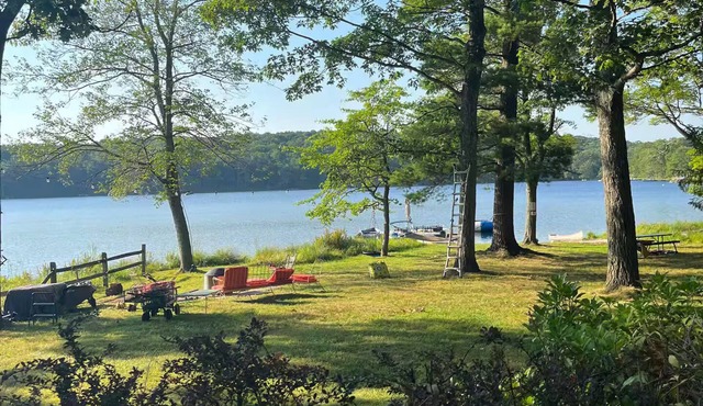 Spring fed Lake front home floating dock and boats in Milford