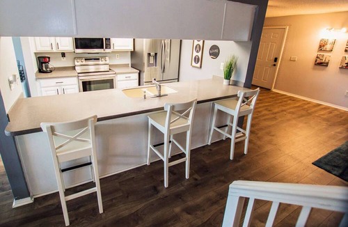 Saddlebrook Condo | Lakeview Townhome Retreat | Workspaces & Patio | Optional Saddlebrook Resort Amenities