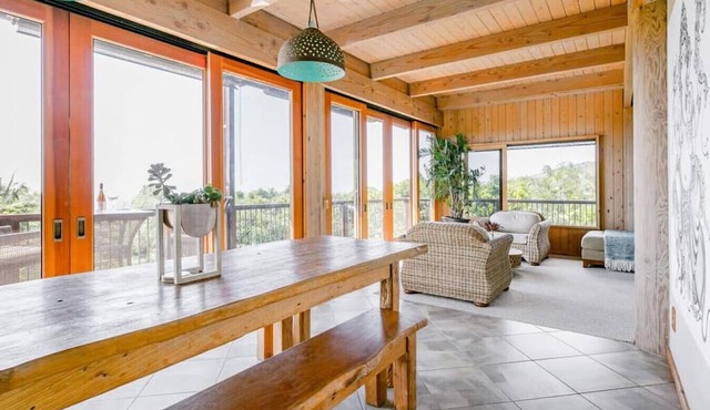 Sweeping Views from a Striking Home with Balconies
