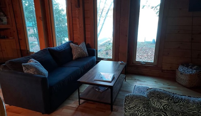 Modern lakeside log cabin on pristine East Pond Oakland Maine's Belgrade Lakes in Oakland