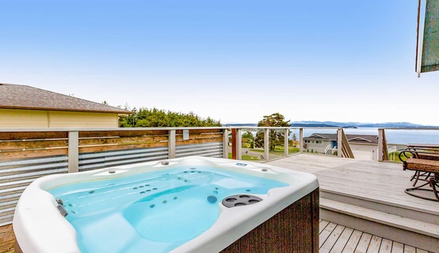 Updated Water View Gem with Deck, BBQ/Outdoor Dining, Hot Tub, Fireplace, & WiFi